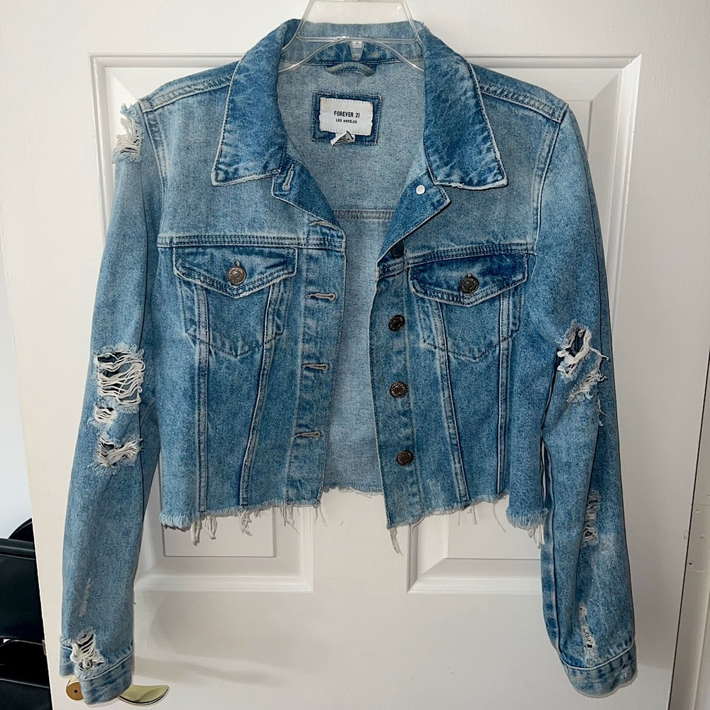 Slightly cropped ripped jean jacket